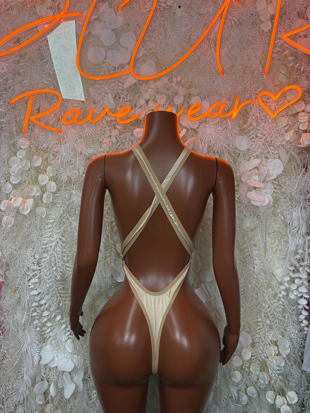 Nude sheer backless bodysuit with X-back straps and thong back