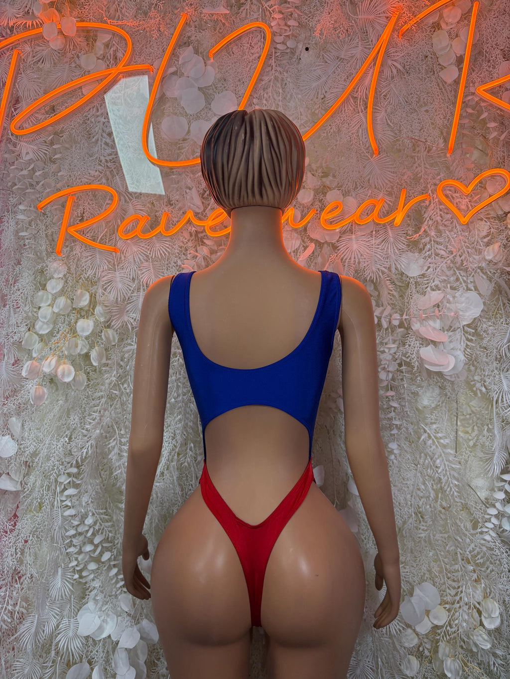 Women's one-piece swimsuit back view: blue straps, red high-cut bottom