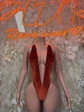 Velvet one-piece bodysuit, deep red with high-cut legs and plunging neckline.