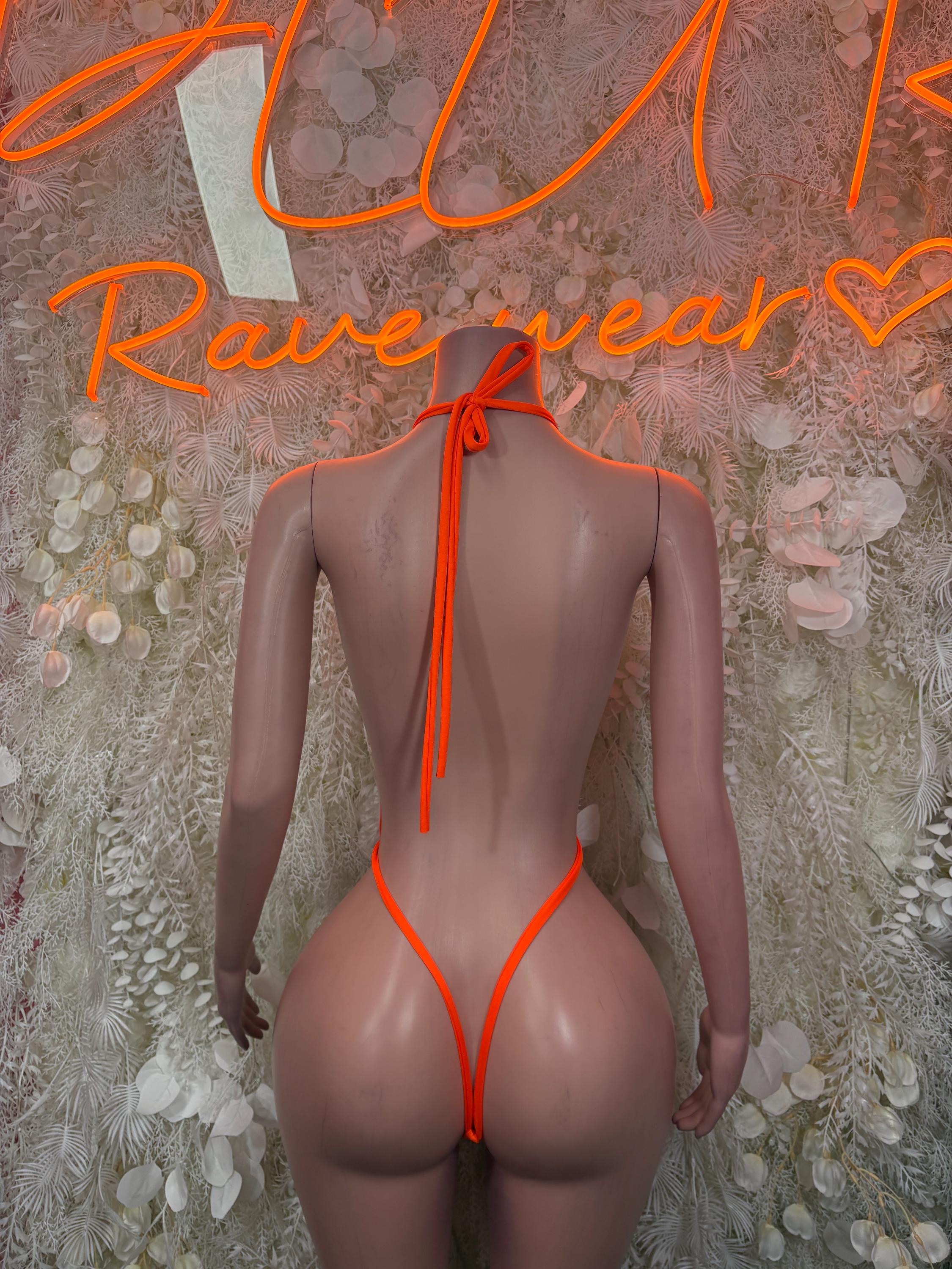 Orange one-piece bodysuit back with vertical cutout and tied strap closure, high-cut legs