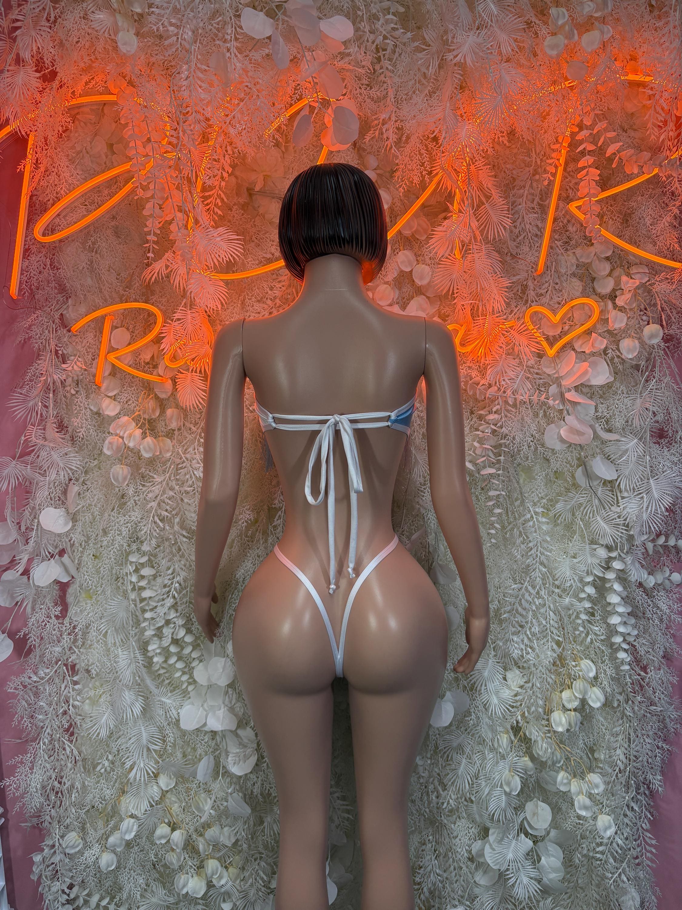 Light-blue one-piece swimsuit, open-back tie at waist with white string details