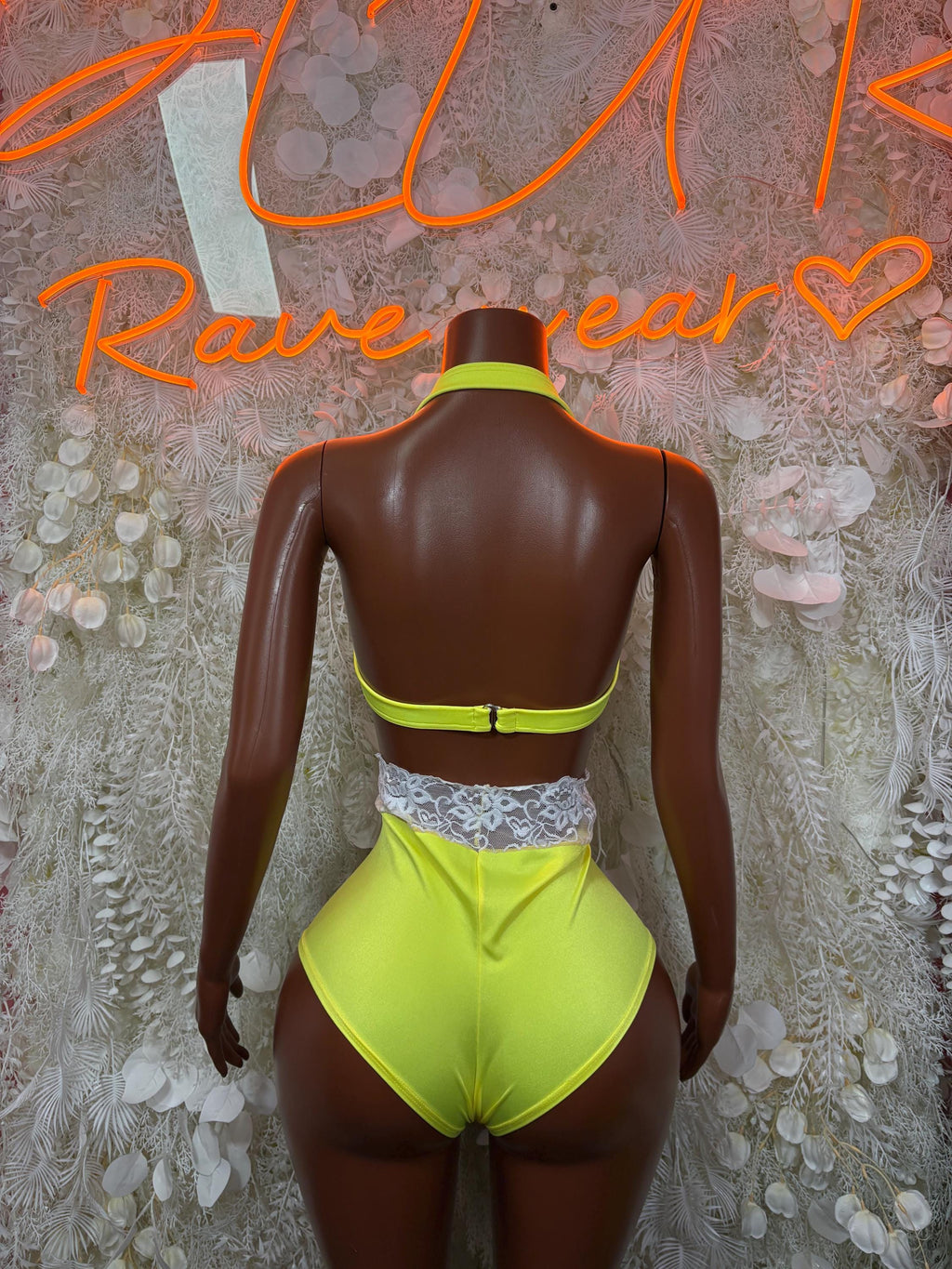 Neon lime green rave two-piece set, back view: racerback top and high-waist bottoms