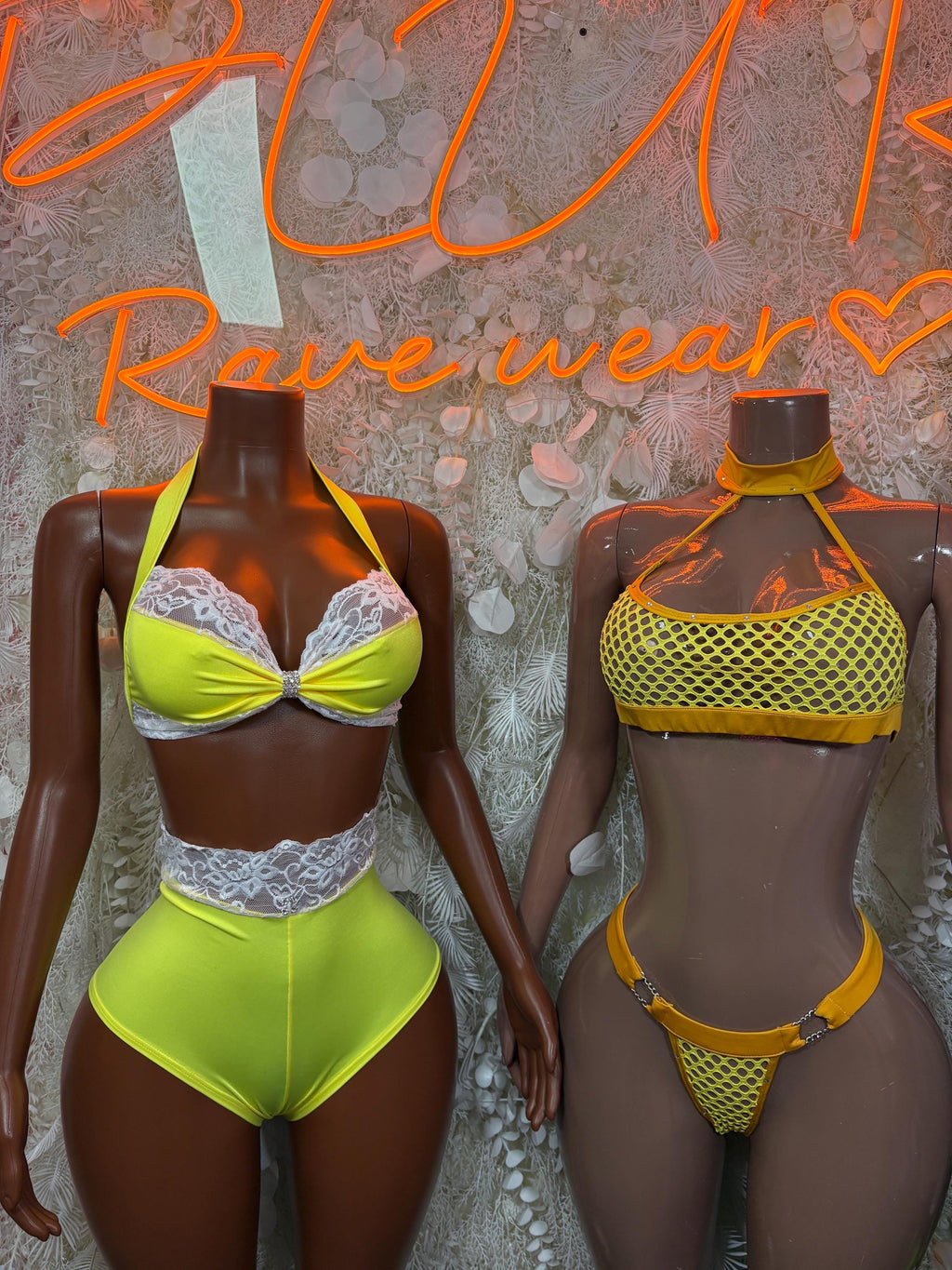 Neon rave two-piece set on two models: lace triangle bra, high-waist bottoms
