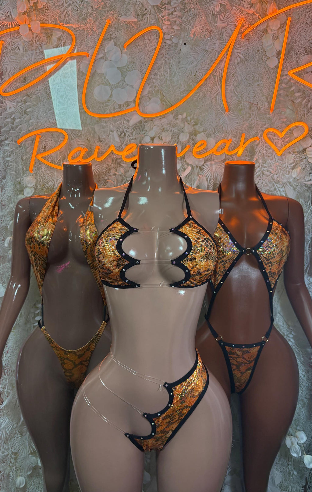 Orange snake-print one-piece dancewear with plunging front and scalloped trim