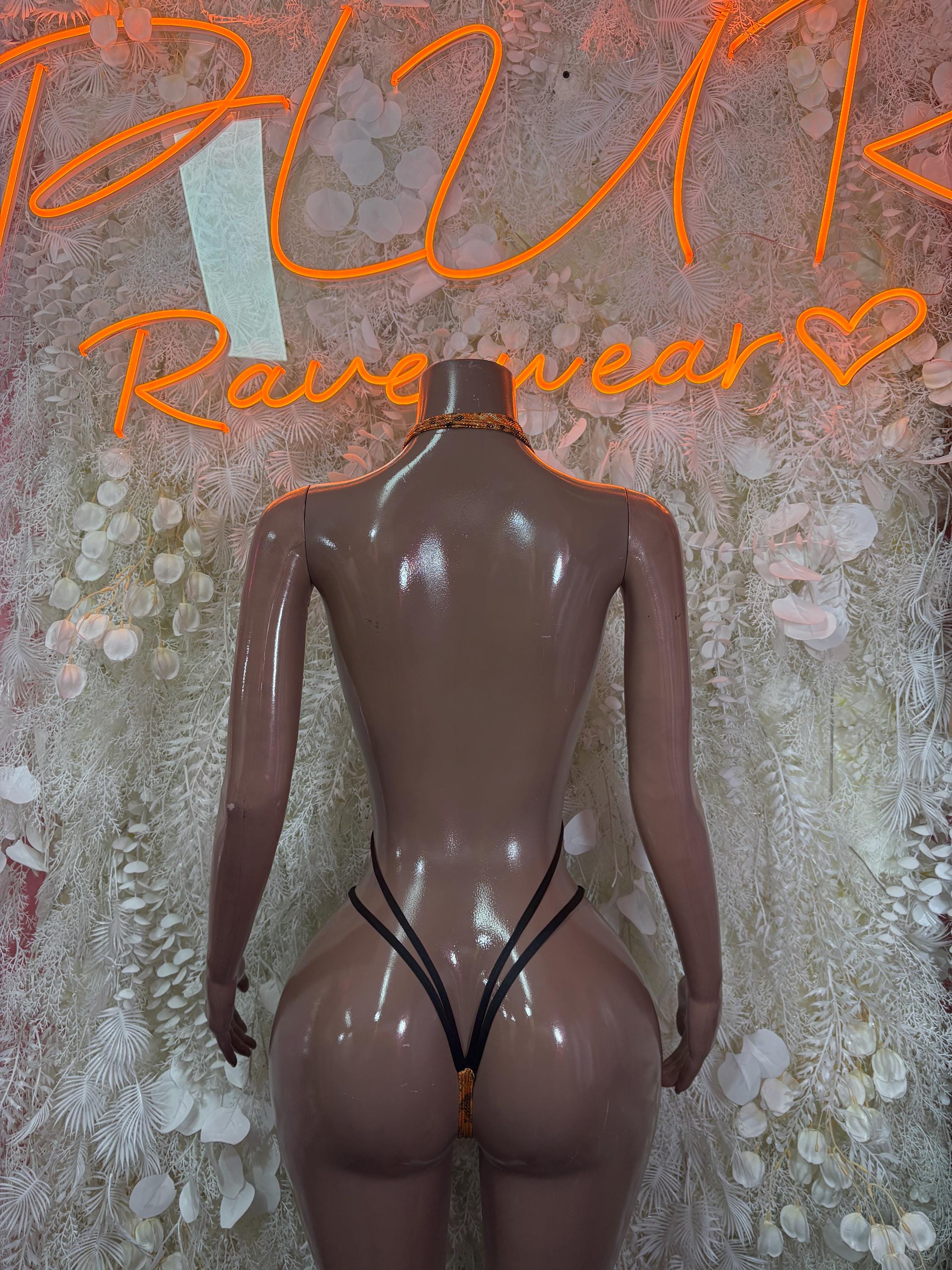 Orange snake-print one-piece dancewear with V-back and crossover straps