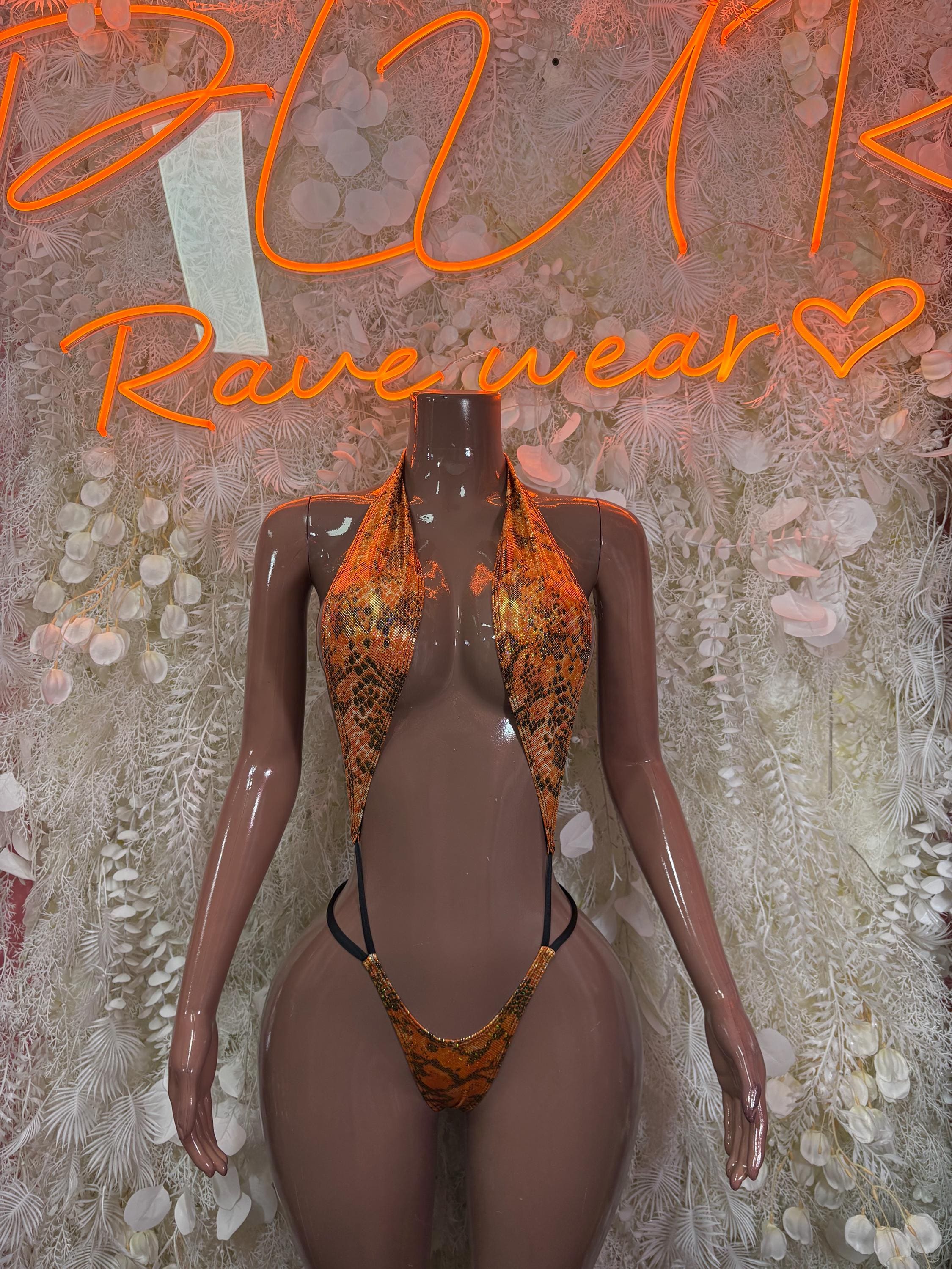 Orange snake-print one-piece dancewear with halter top, cutout sides, and thong back