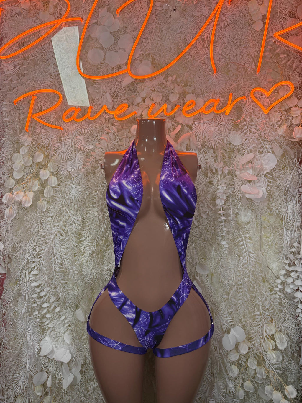 Purple bodysuit with high-cut legs and crisscross front straps