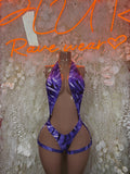 Purple bodysuit with high-cut legs and crisscross front straps