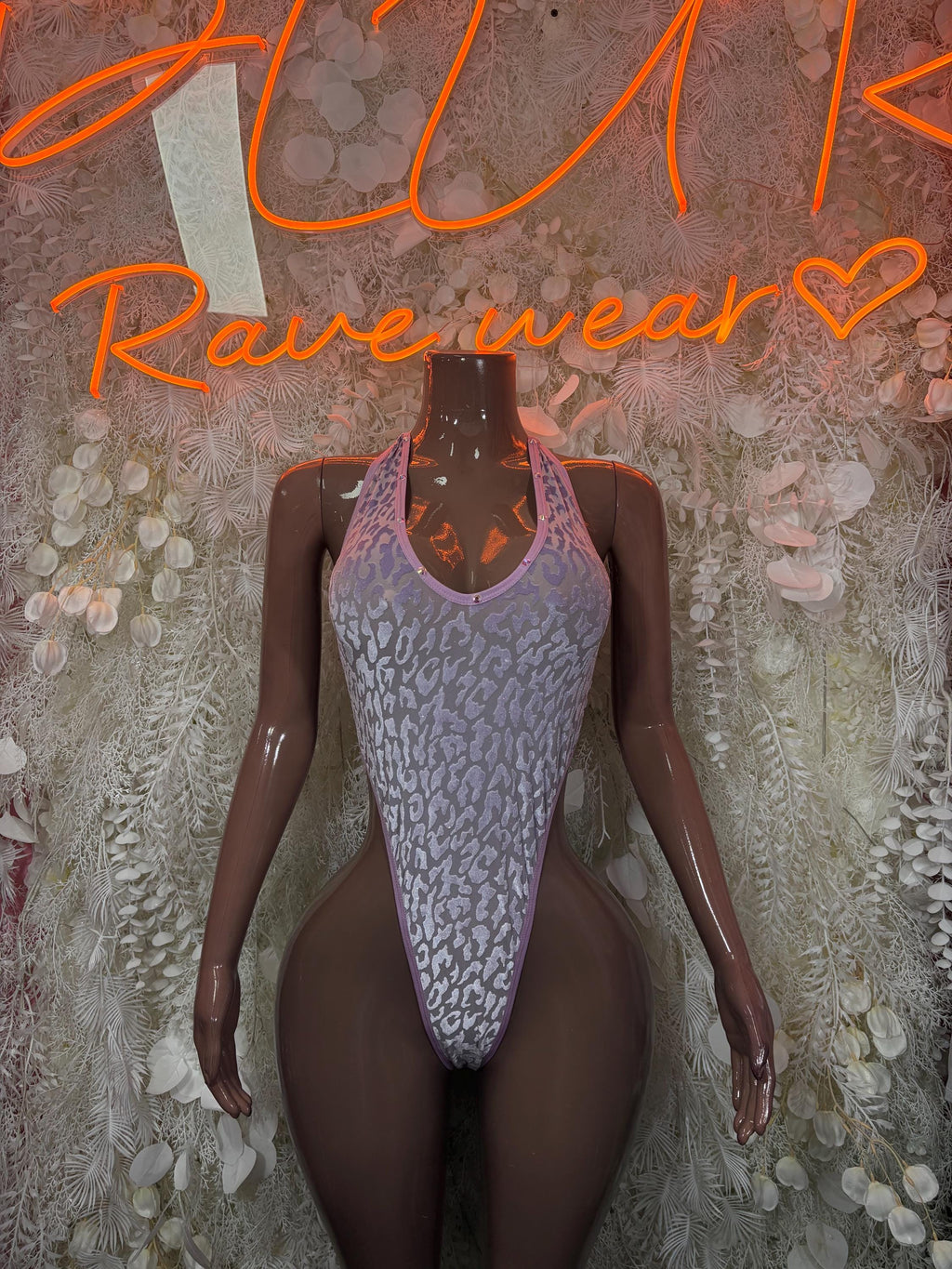 Purple mesh bodysuit with U-neck and cheeky high-cut legs on mannequin