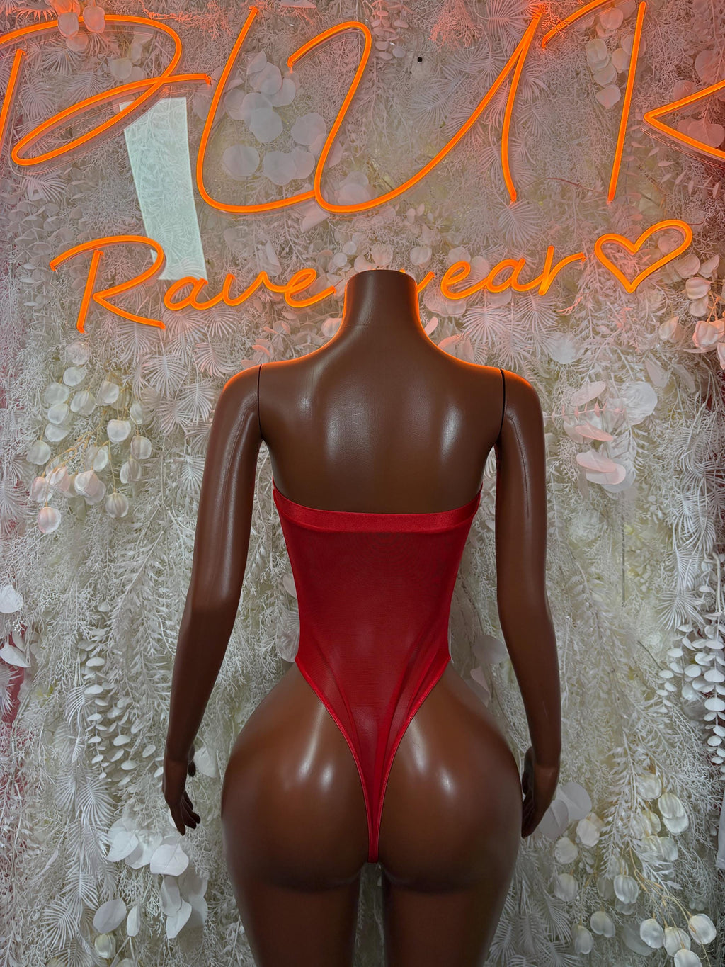 Red long-sleeve bodysuit with open back and high-cut legs