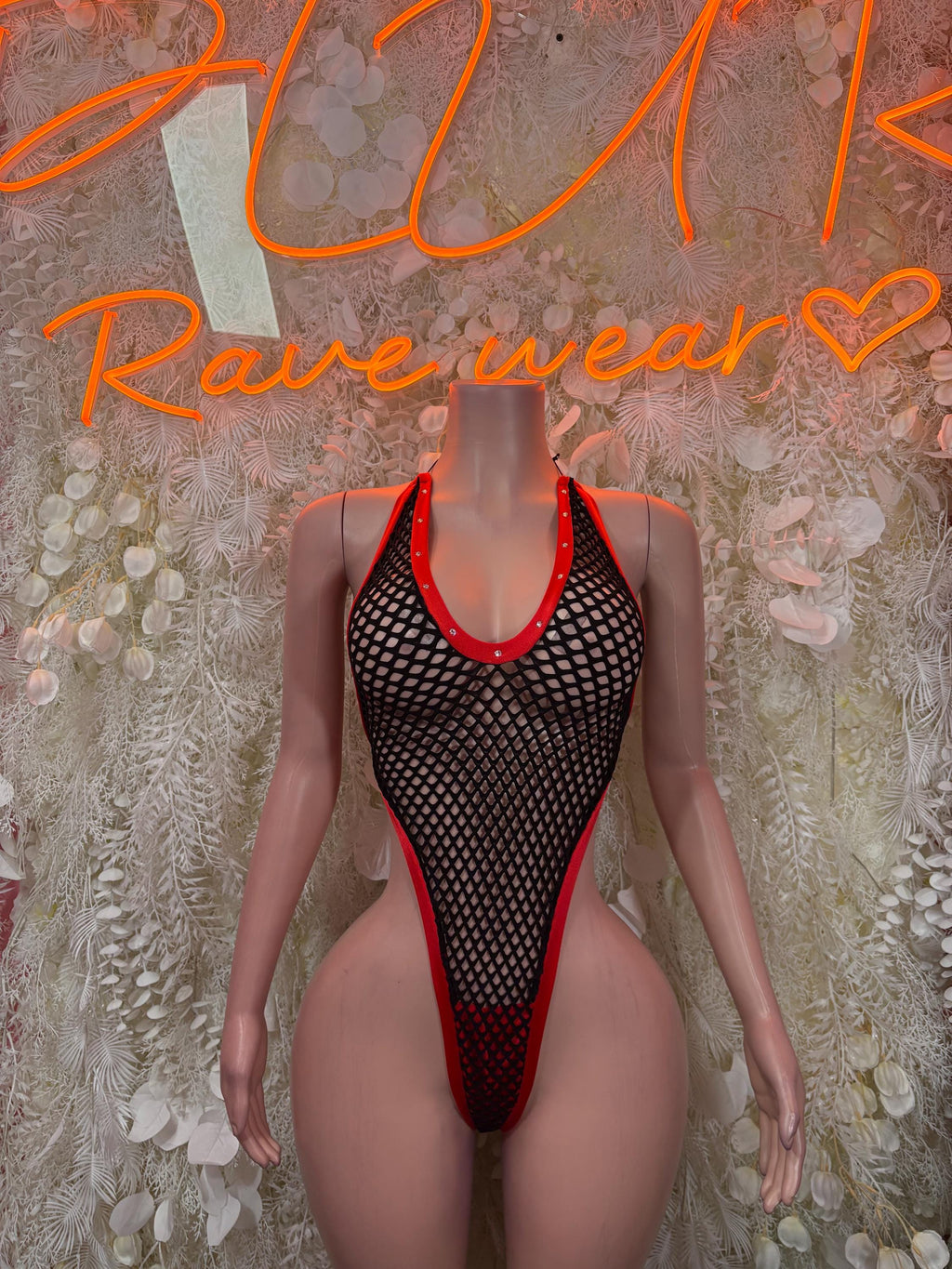 Black fishnet bodysuit with high-cut legs and red-trim neckline