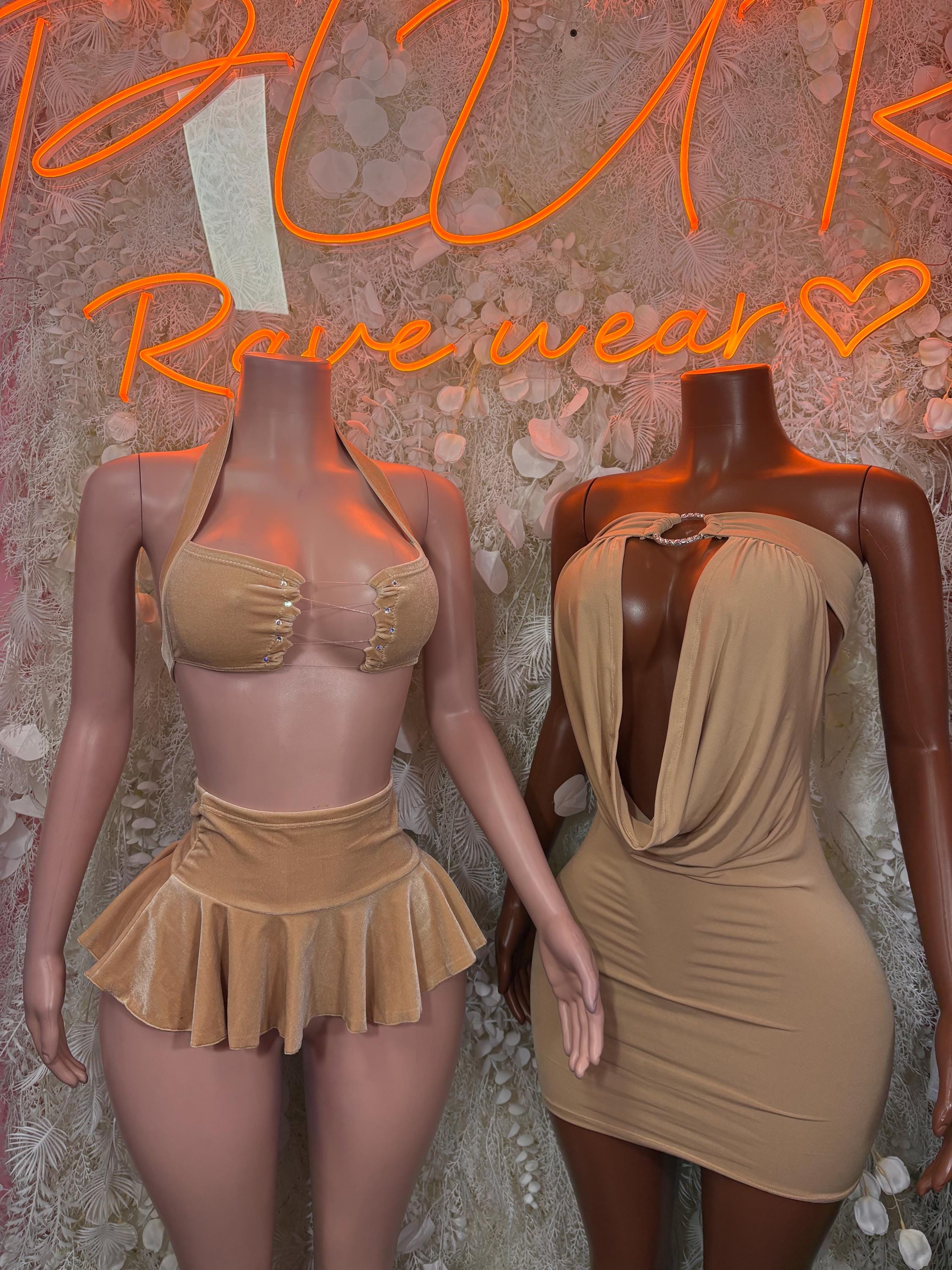 Nude rave mini dress with draped front and low back on mannequin