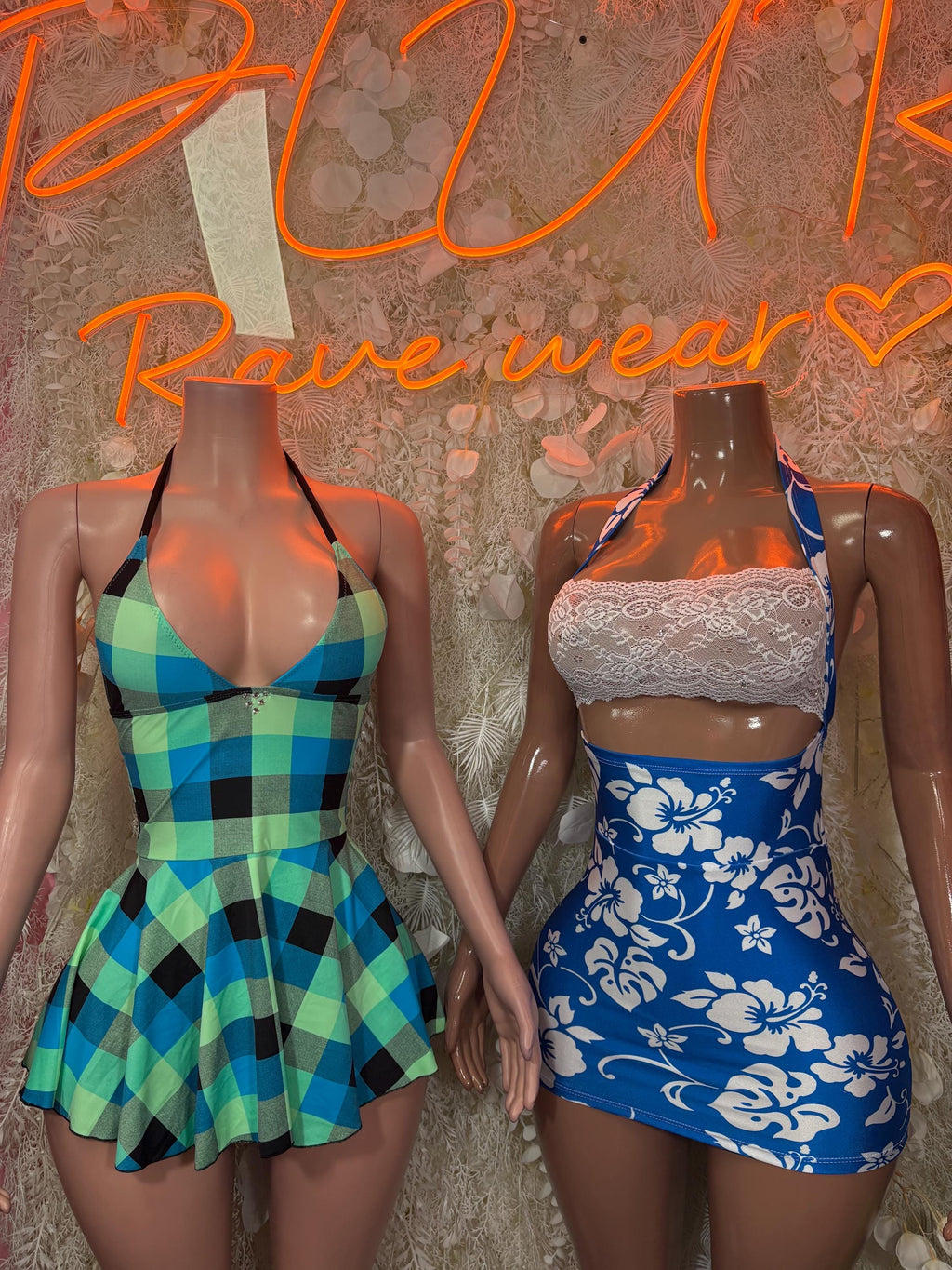 Pair of one-piece dresses: blue floral bodysuit and turquoise plaid dress