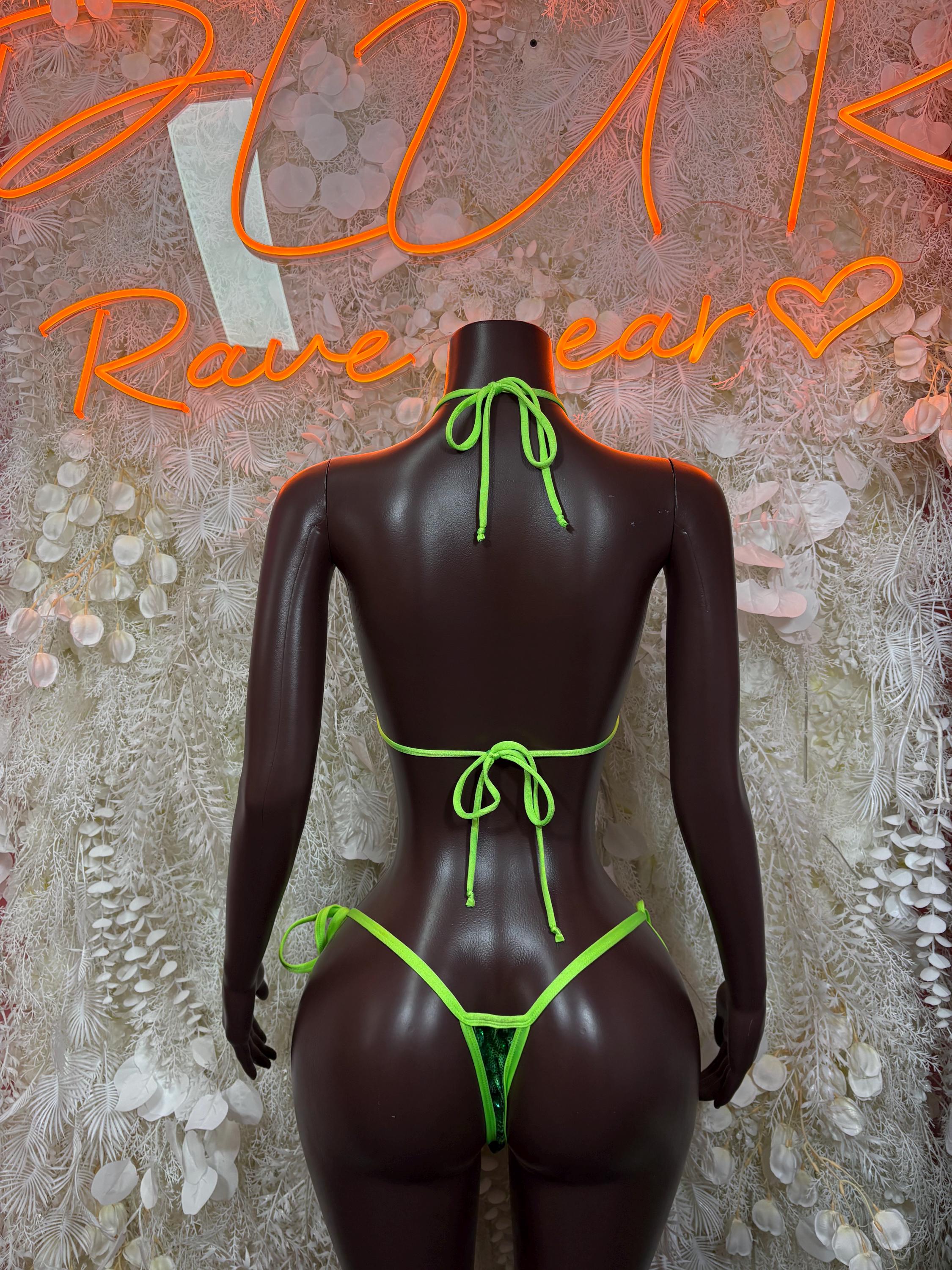 Green metallic bikini set with neon tie-back bottom and string halter top on mannequin back