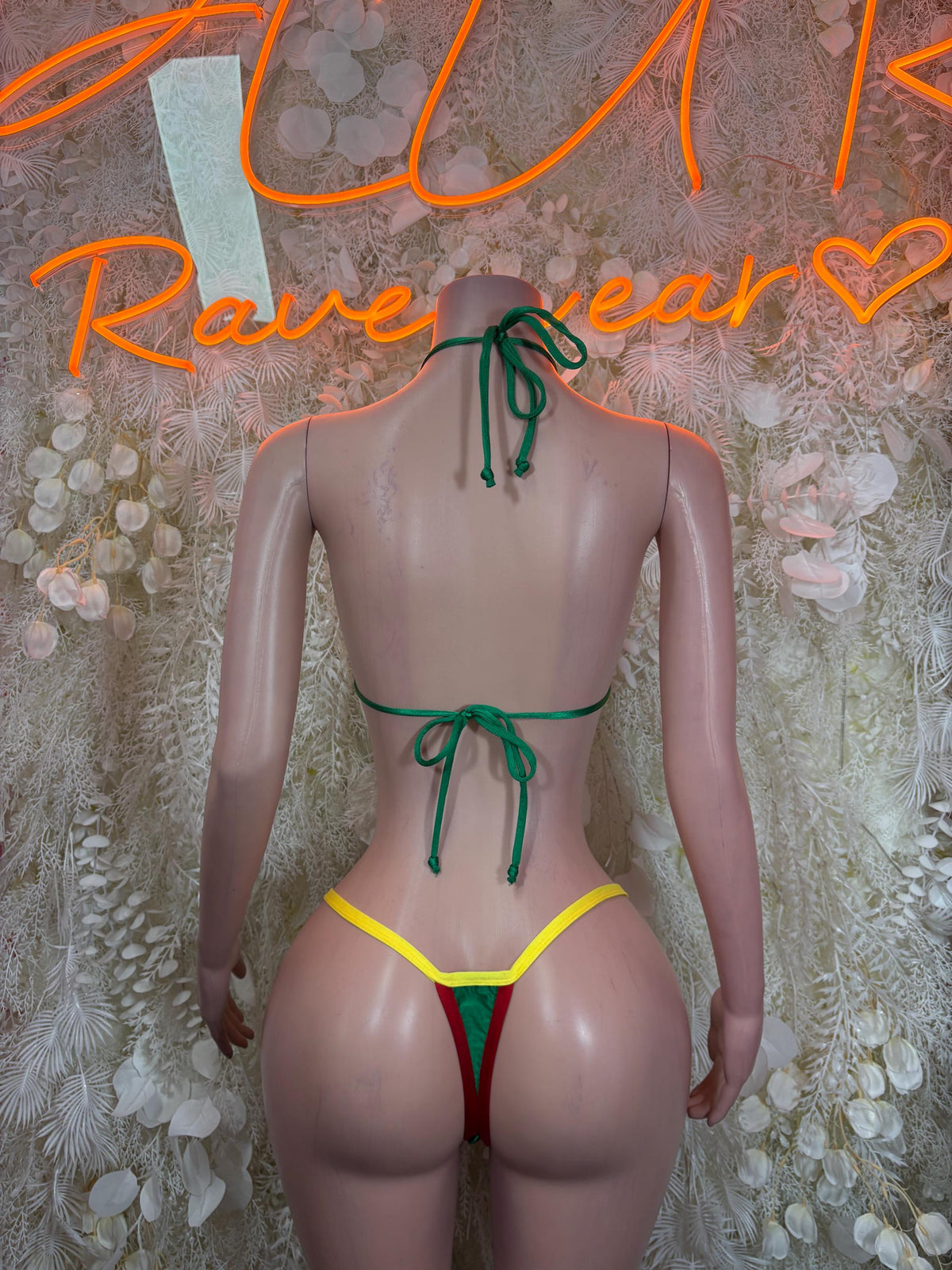 Back view flag-print triangle bikini, green neck tie and red/yellow/green bottoms ties