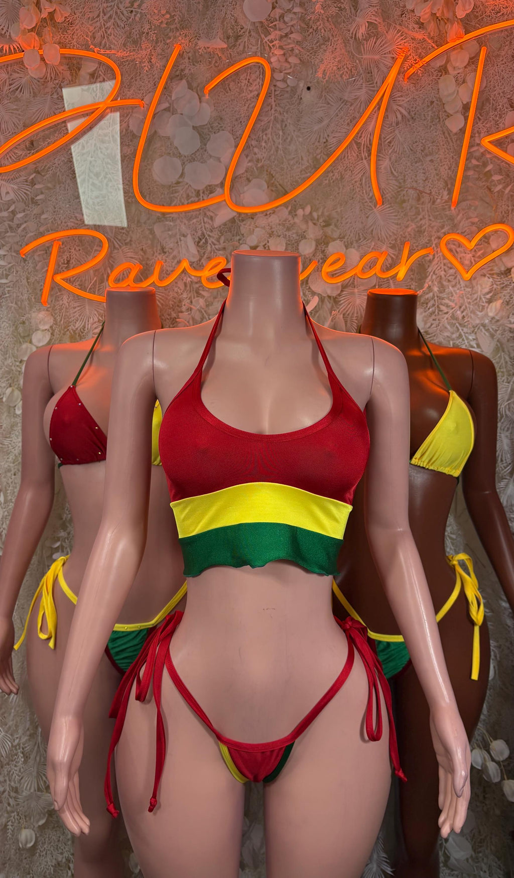 Bolivian flag bikini swimsuit with red top, yellow band, green trim, and tie fringe bottoms