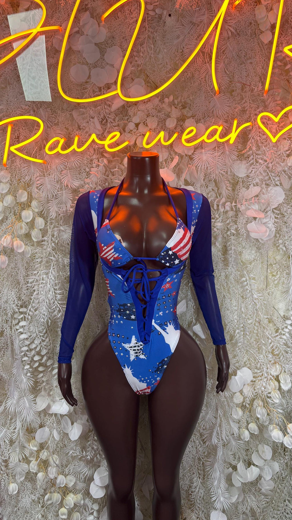 Blue star-and-stripe bodysuit with long sleeves and lace-up back