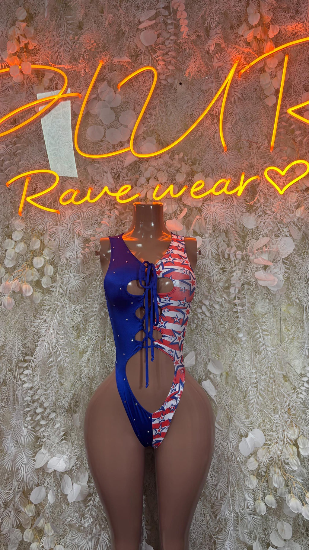 Patriotic American flag bodysuit with blue side panels and lace-up front, one-piece