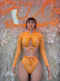 Orange rhinestone festival two-piece bodysuit with long sleeves and front cutout