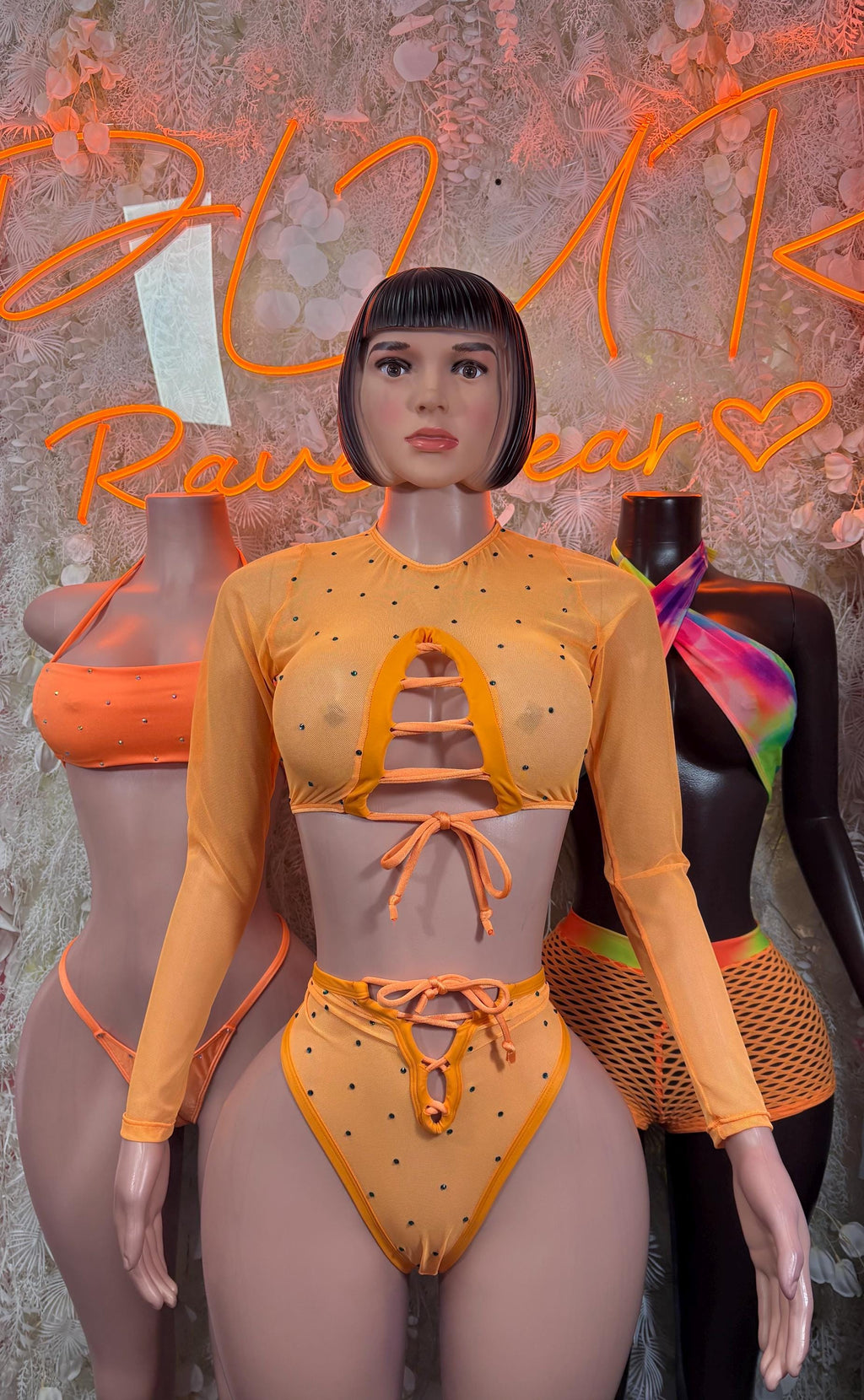 Orange strappy festival bikini set with long-sleeve mesh shrug and high-cut bottoms