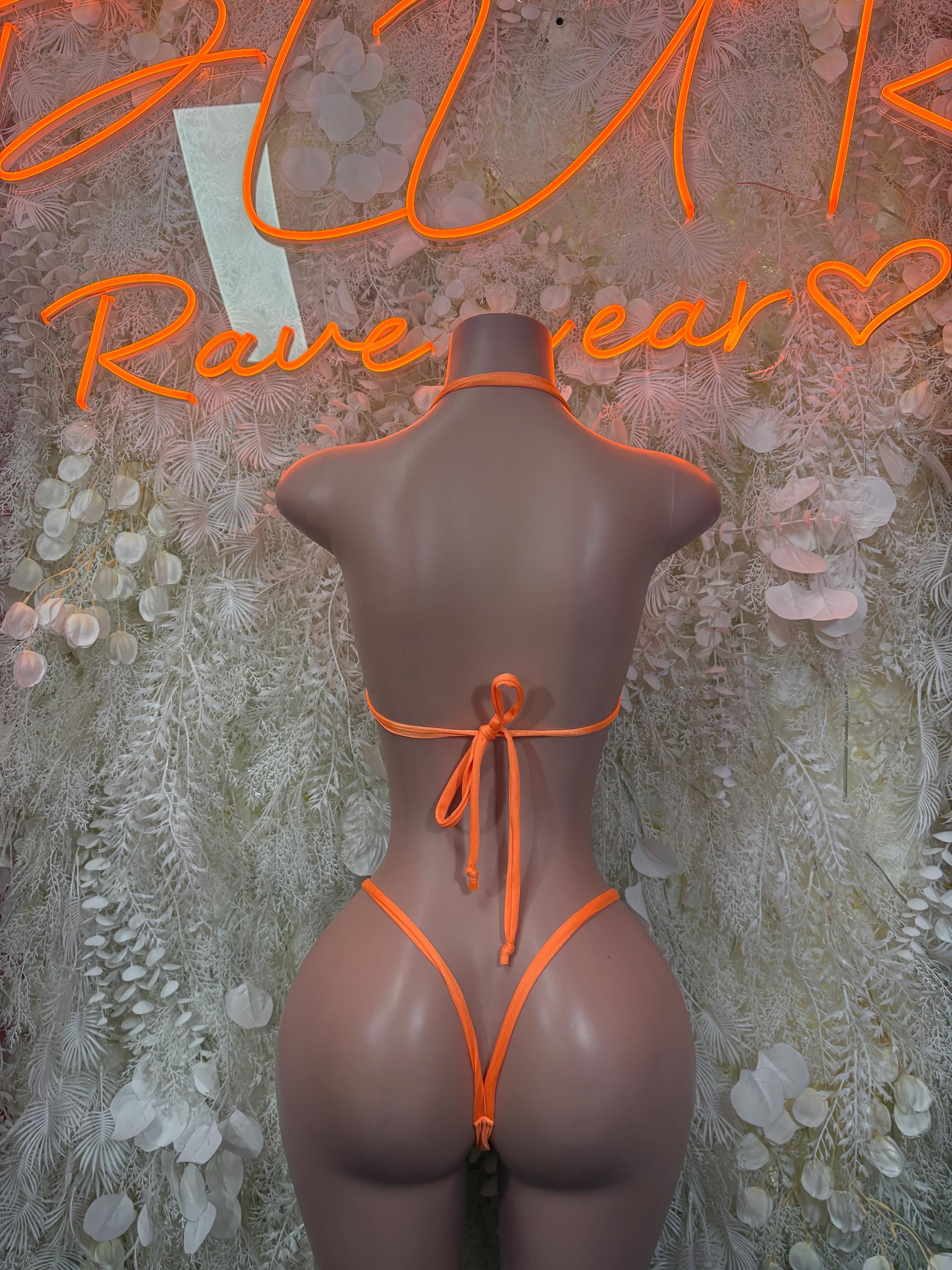 Orange strappy festival bikini set with halter back and thong-style bottoms