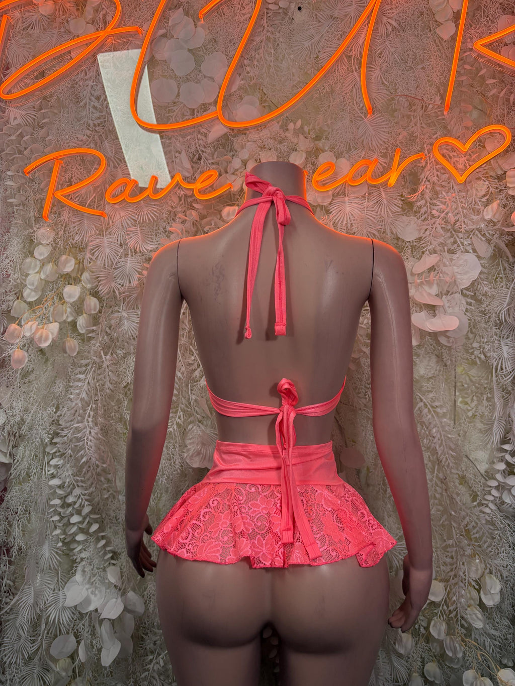 Coral-pink lace halter bra with back tie and ruffled mini skirt set