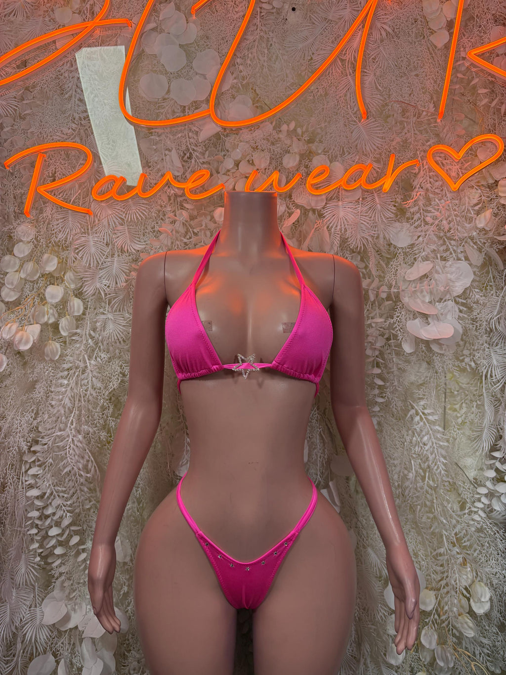 Pink triangle bikini top with matching string bikini bottoms, side-tie style.