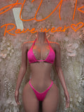 Pink triangle bikini top with matching string bikini bottoms, side-tie style.