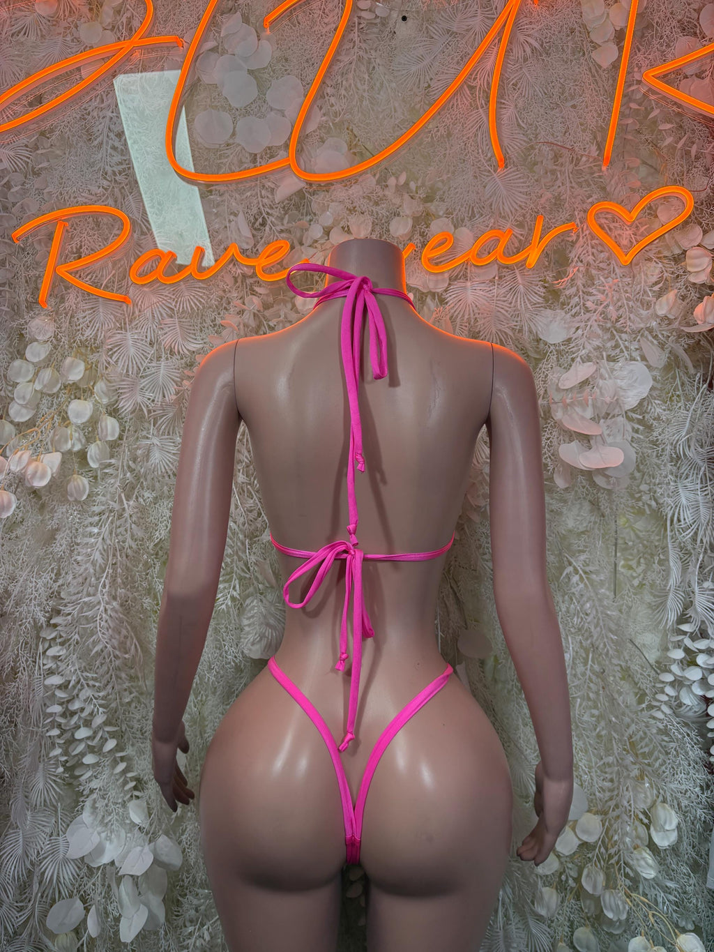 Pink bikini bottom and backless tie straps, with crisscross center ribbon.