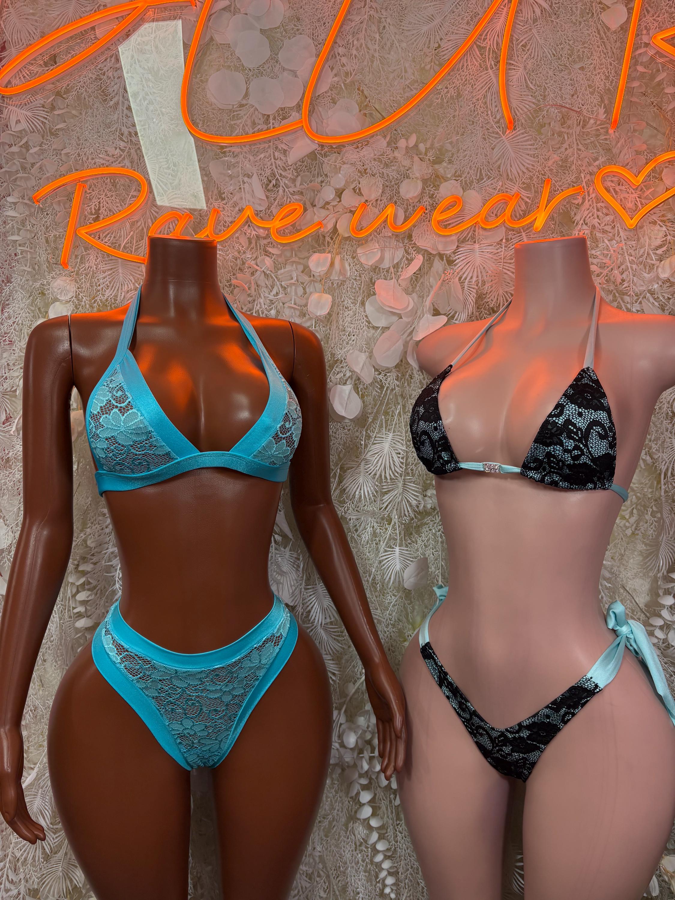 Two-piece bikinis on mannequins: blue lace set and dark lace set, front view