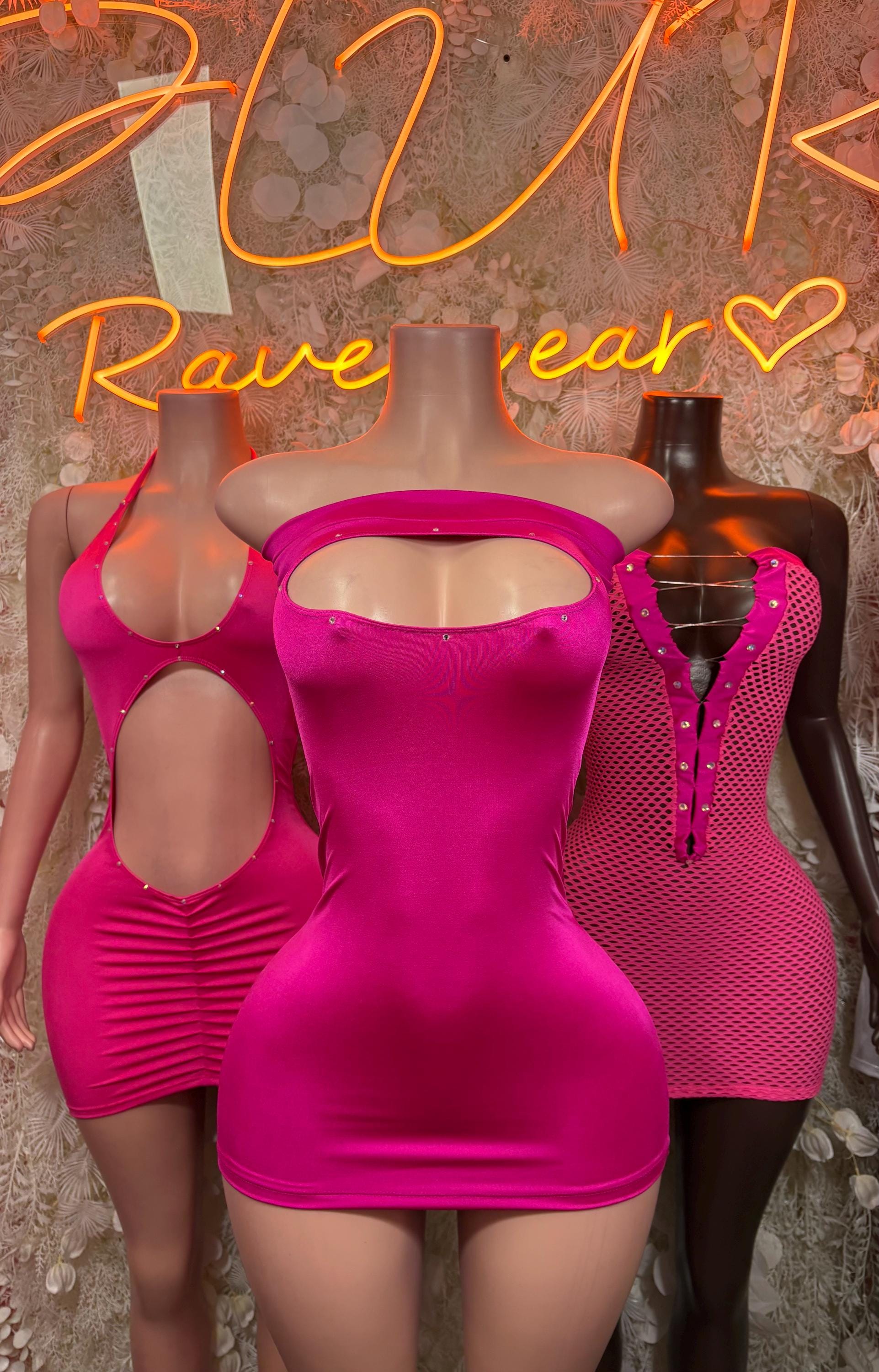 Pink fishnet mini dress on mannequin beside matching pink sleeveless dress