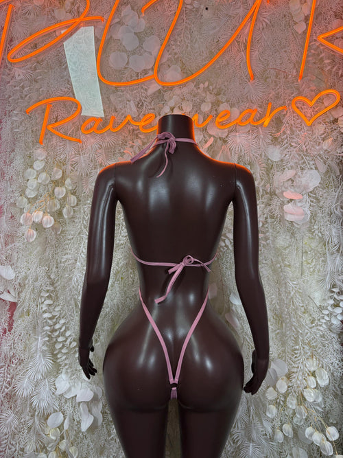 Metallic baby pink halter thong bodysuit with bow-tied straps and open back