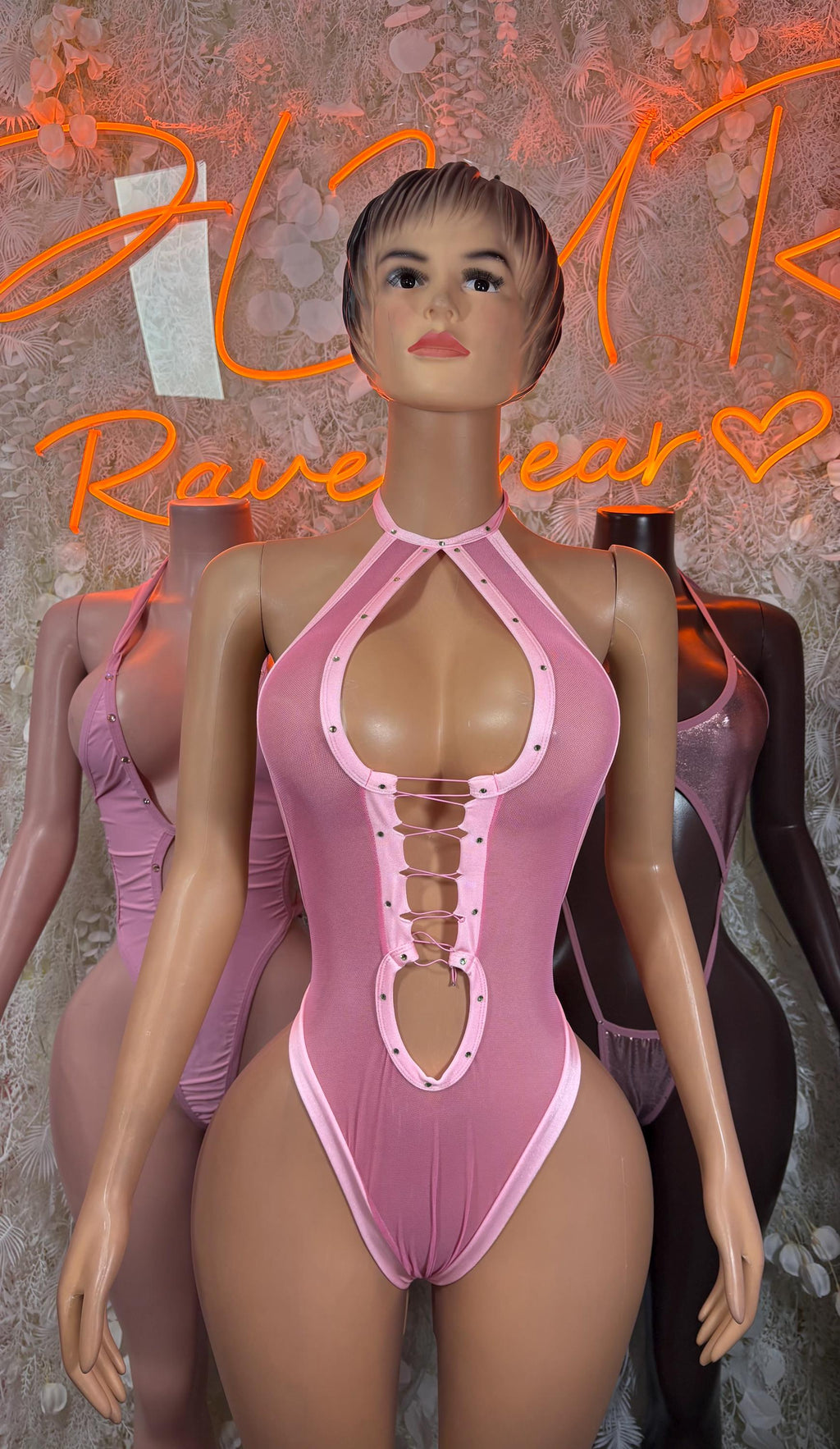 Metallic baby pink halter bodysuit with crisscross neckline and buttoned center