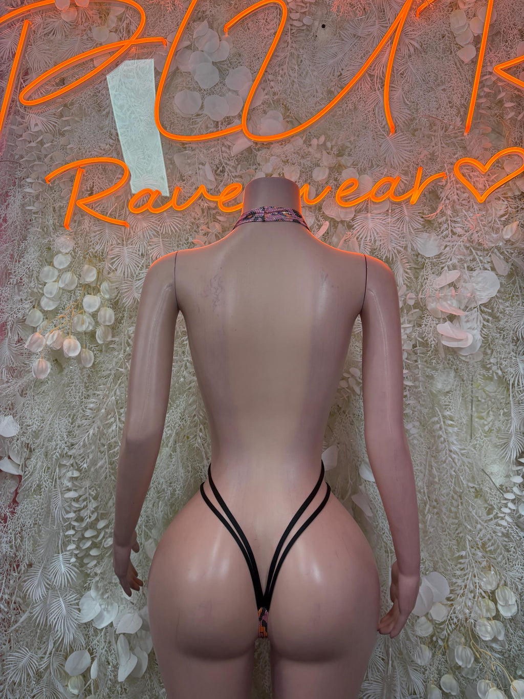 Cheetah-print one-piece swimsuit with V-shaped back straps and thong cut
