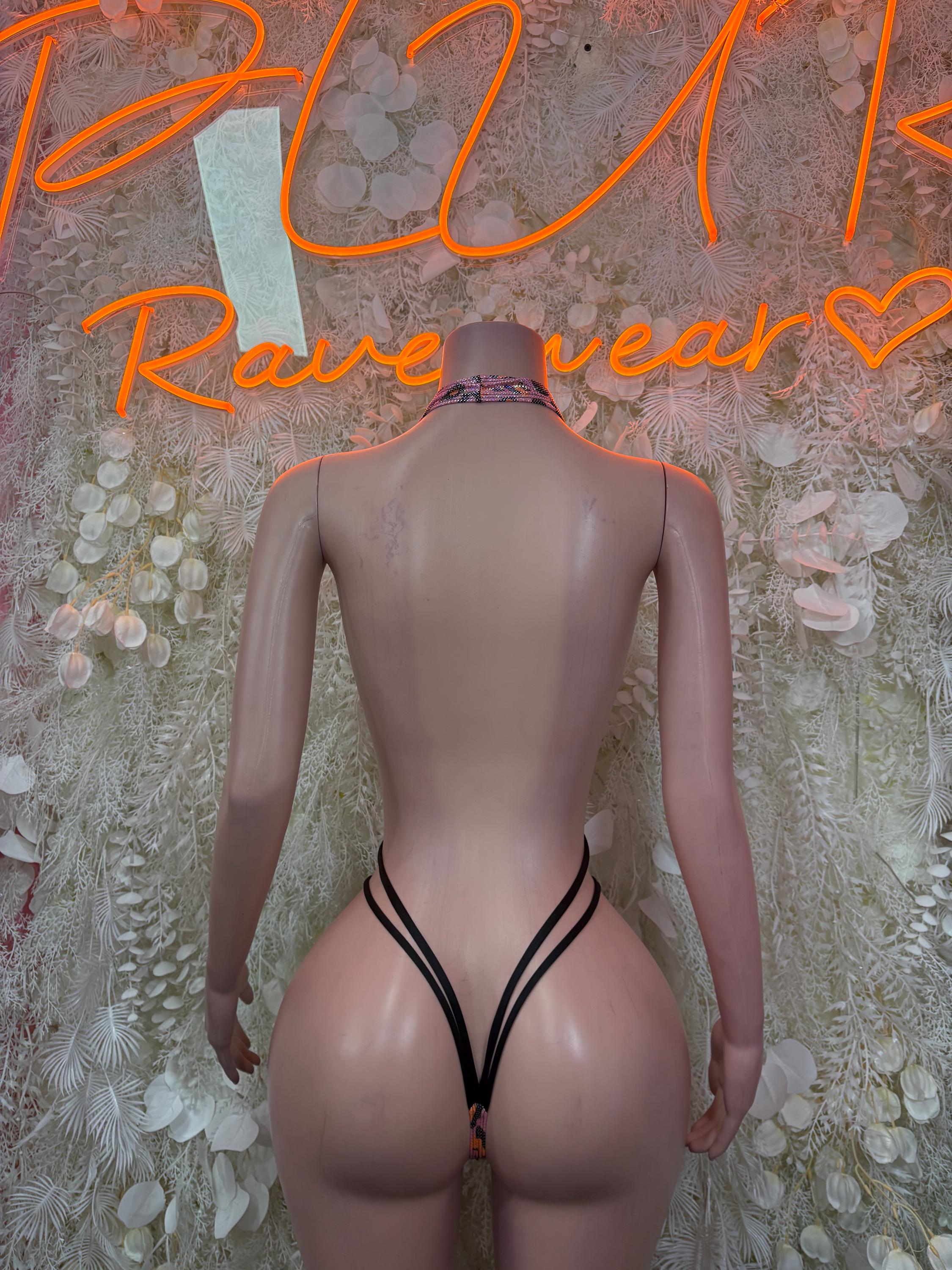 Cheetah-print one-piece swimsuit with V-shaped back straps and thong cut