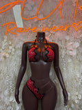 Two-piece lingerie set with red bandanna print, black trim, bra and thong bottoms