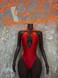 Red bodysuit with black sheer long sleeves, deep V neckline and center cutout