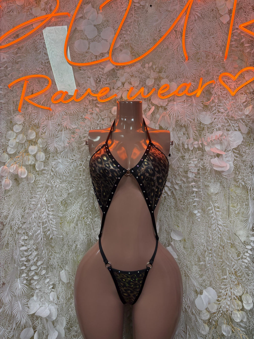Black-and-gold cheetah print hologram bodysuit, open back, thong