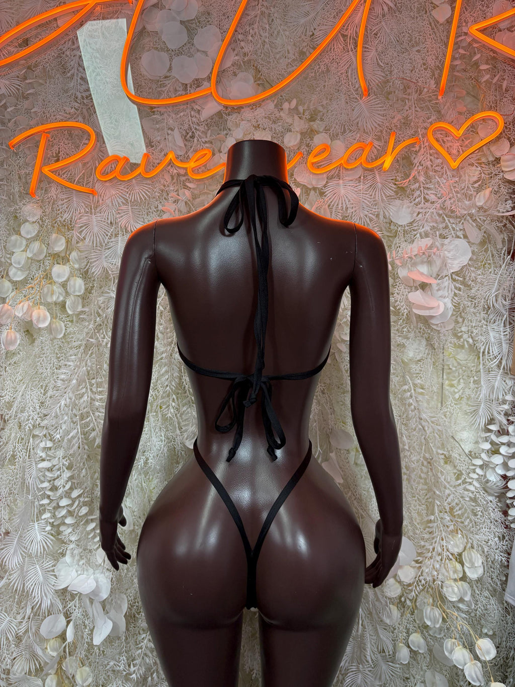 Back of cheetah-print hologram bikini bodysuit with lace-up tie at center