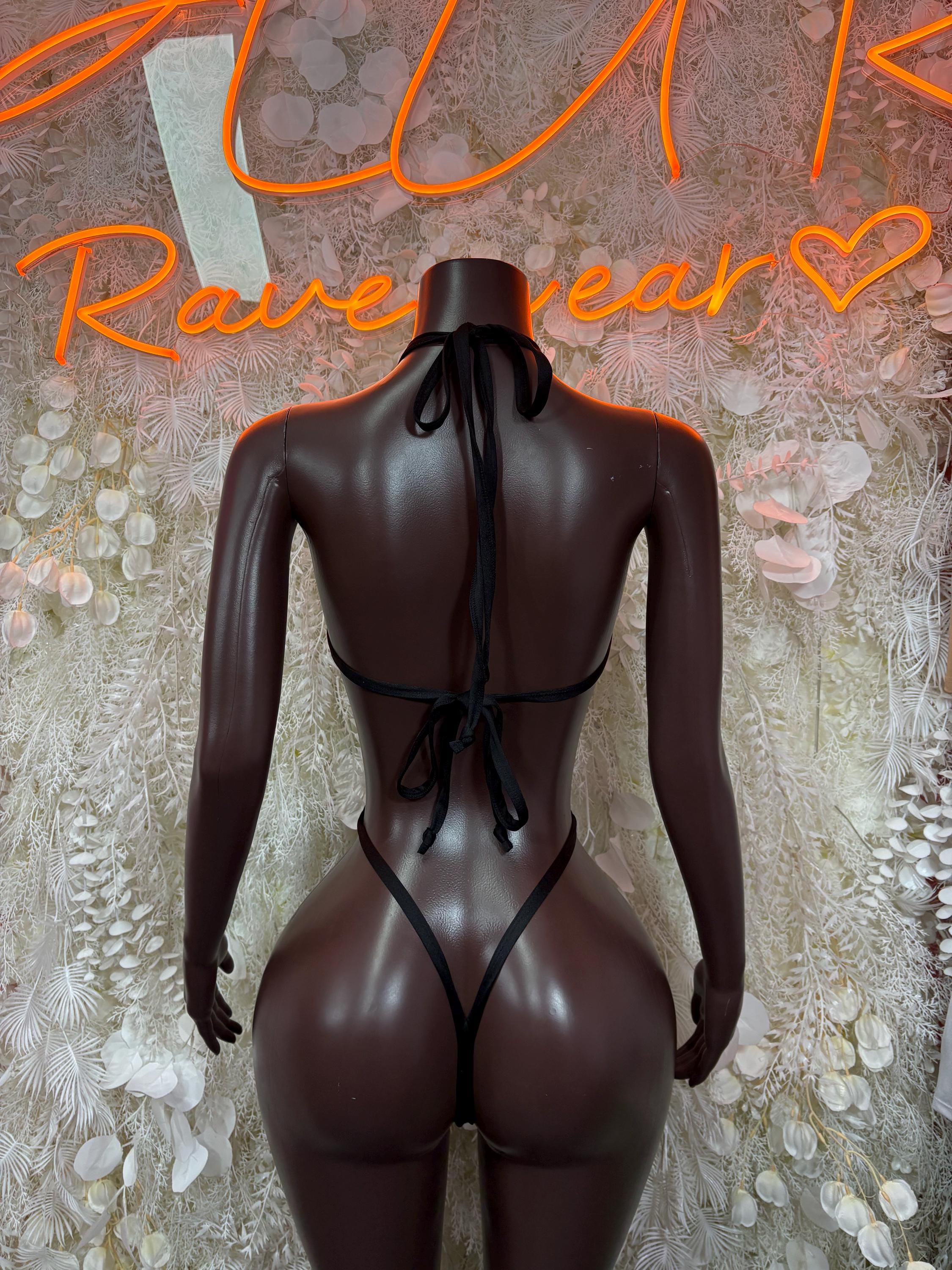 Back of cheetah-print hologram bikini bodysuit with lace-up tie at center