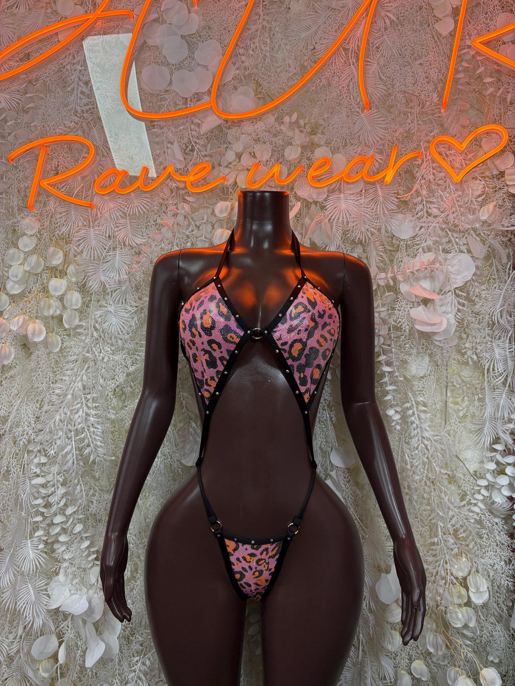 Cheetah-print hologram bikini bodysuit with black triangle cutouts