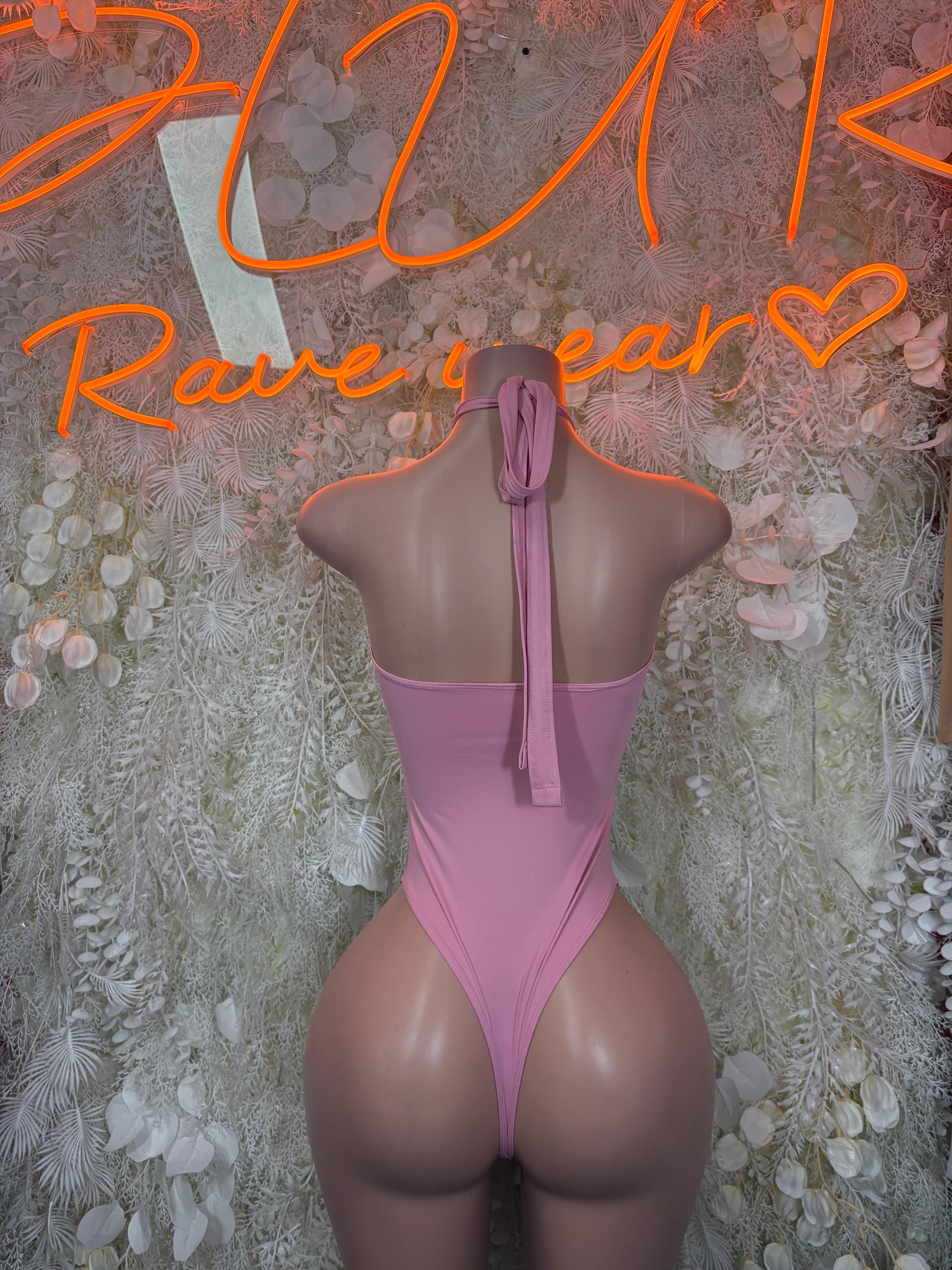 Pink halter cutout bodysuit with open back and tie straps, minimal-coverage fit