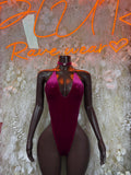 Purple velvet halter bodysuit with deep V neckline, smooth one-piece front view