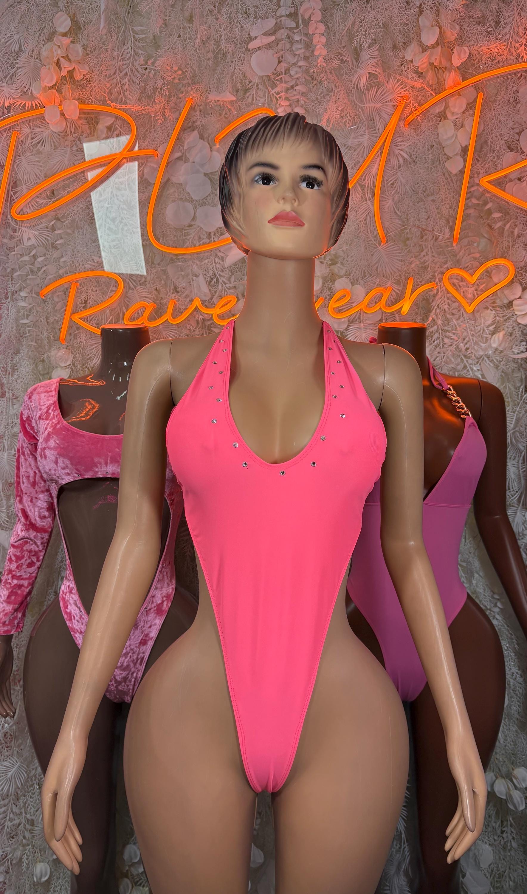 Pink velvet bodysuit with halter neckline and small jeweled accents on mannequin