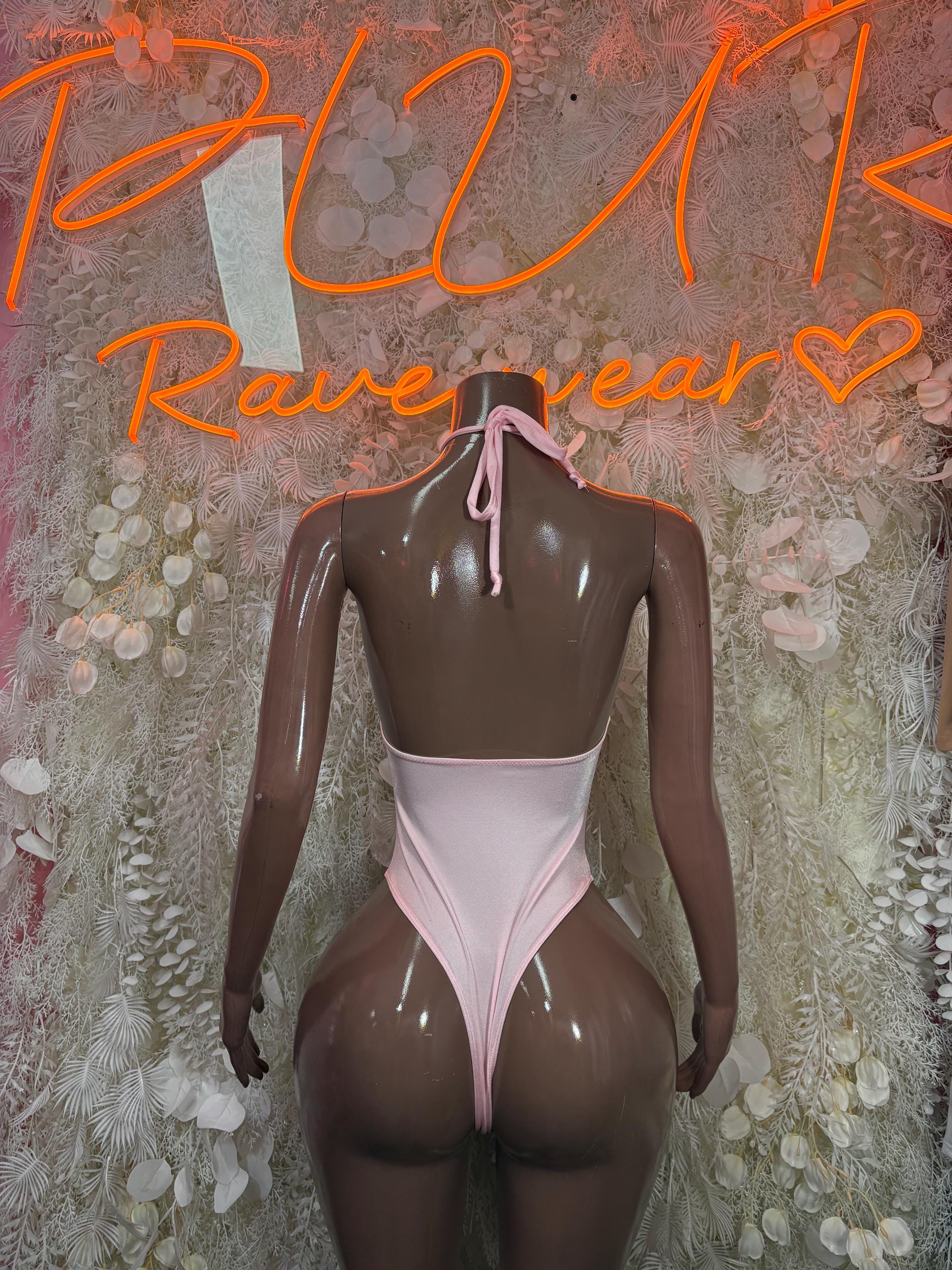 Light pink halter bodysuit with crisscross lace front and tie neck