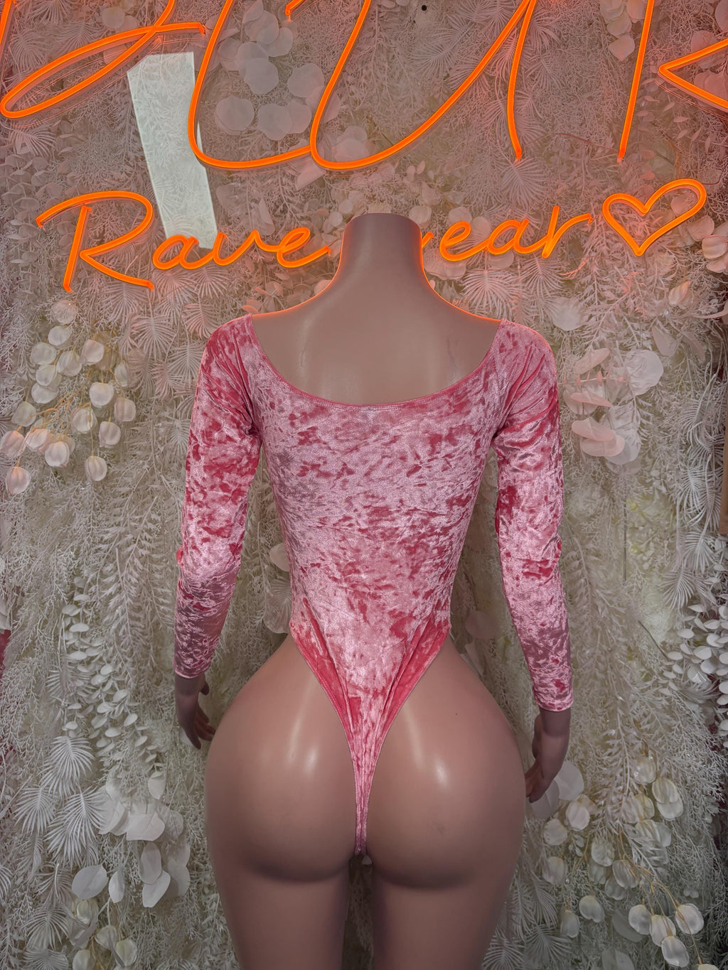 Pink velvet dance bodysuit with long sleeves and scoop neckline