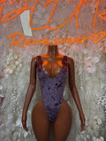 Purple velvet one-piece bodysuit with scoop neckline, fitted front view