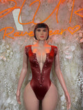 Burgundy long-sleeve bodysuit with deep V neckline and button front