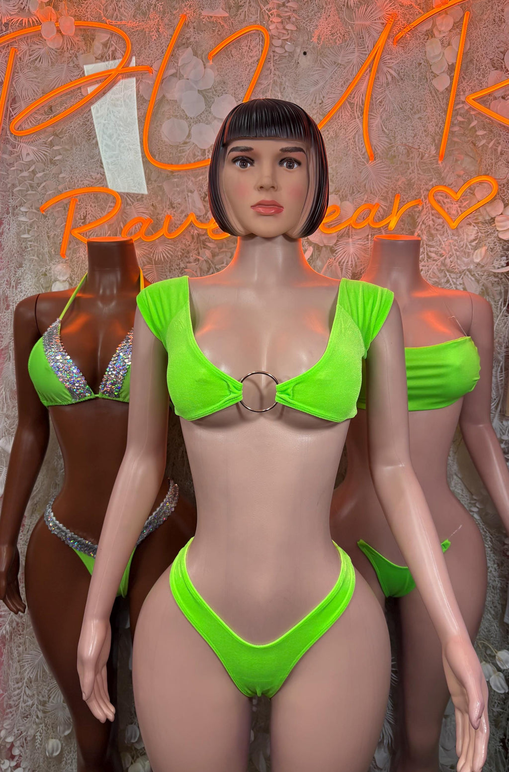 Neon green two-piece bikini with ring clasp center and cheeky V-cut bottoms