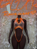 Orange lace cutout one-piece bodysuit with halter neckline and high-leg straps